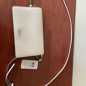 Coach white/gold fold over crossbody clutch